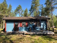 Cozy hut at lake side in Mora