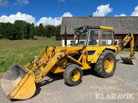 Grävlastare med hymas aggregat Massey Ferguso