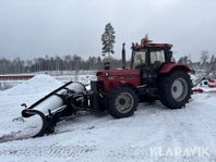 Plogtraktor Case 1255XL med snöplog och sidov