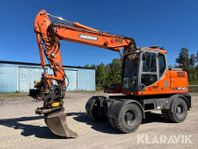 Hjulgrävare Doosan DX140W med tiltrotator och