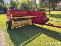 Höpress New Holland med en Harjo balkastare