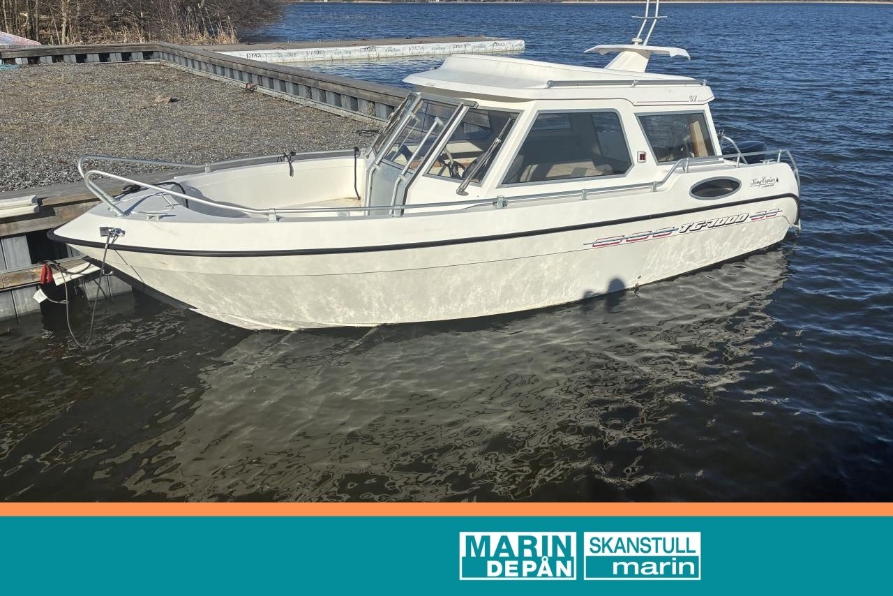 TG 7000 (1998) med Suzuki 140...