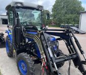 Traktor, Blue 504, hytt, frontlastare och 4 i en skopa ingår