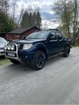 Navara a-traktor med rost.