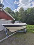 Bella 510R Mercury 90 hp Tiki 80 trailer