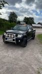 A Traktor Nissan Navara d40