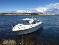 Bella 561 HT 60hk med 80-trailer. 