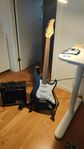 Electric Guitar with soundbox, guitar stand and other tools.