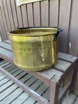 A big copper pot or bucket with handle