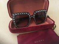 solglasögon Gucci.