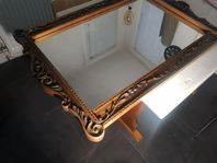 Hand-carved mirror frame