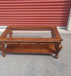wood coffee table with glass top in good condition 