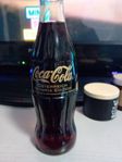 en oöppnad Coca-Cola flaska från os i Österrike