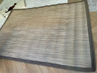 tan color area rug