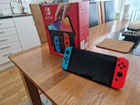 Nintendo Switch OLED + spel konto med 12 spel