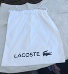 LACOSTE . Dust bag