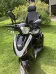 Promenadscooter med garanti körd 8 mil