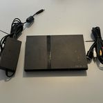 Playstation 2 slim (delvis defekt - läser ej av skivan)