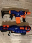 nerfguns en på el och en annan som skjuter 3 skott per gån