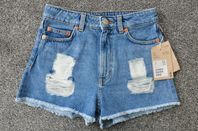 Monki jeans blåa slitna shorts dam demin ljus rock vintage