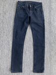 Svarta jeans modell long John strl 28/30 från Nudie Jeans