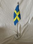 Vacker bords flagga med marmorfot