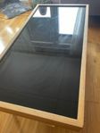 Wooden coffee table with a glass top