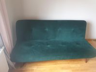 Reclining green sofa