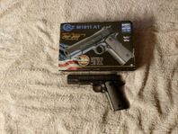 CO2 PISTOL. COLT M1911 A1 100TH ANNIVERSARY EDITION 6MM