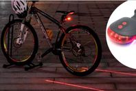 Cykelbelysning med laserstrålar projicerade på marken