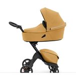 En stokke barnvagn xploryx gul