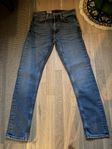 Oanvända Nudie Jeans Co orange jeans, storlek W28 L30