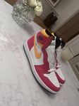 Red and Yellow Jordan 1s ”Light Fusion”