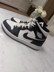 black and white Jordan 1s Retro High Tops