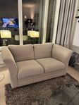 Beige 2sits-soffa