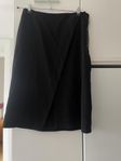 Black wrap skirt with asymmetric detail