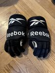 Bandyhandskar Jr, Reebok stl S