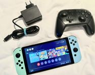 Nintendo Switch OLED: 2290 kr (nyskick) + två spel