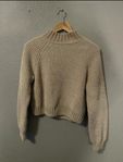 beige knitted jumper