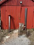 vedeldad kamin utebad