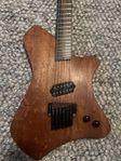 Handgjord huvudlös ergonomisk multiscale gitarr