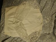 Blus med genomskinliga armar