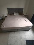 king sized bed with extra boxes