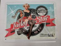 Plåtskylt pinuppa Lucky Star Casino 