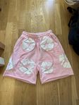 rosa shorts från denim tears 