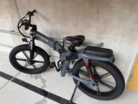 Dual battery electric bike with an attached metal lock