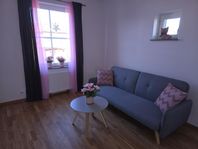 Bäddsoffa grå tyg