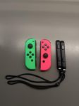 Nintendo joy-cons neon rosa och neon grön