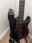 Bass guitar, stand and mini amplifier for headphones