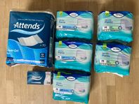 Många paket oöppnade inkontinensskydd Tena & Attends 